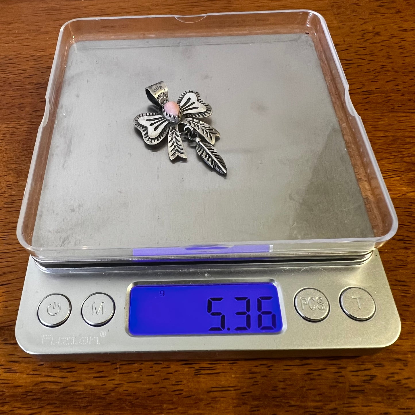 Sterling Silver Queen Conch Bow Pendant with Feather Dangle