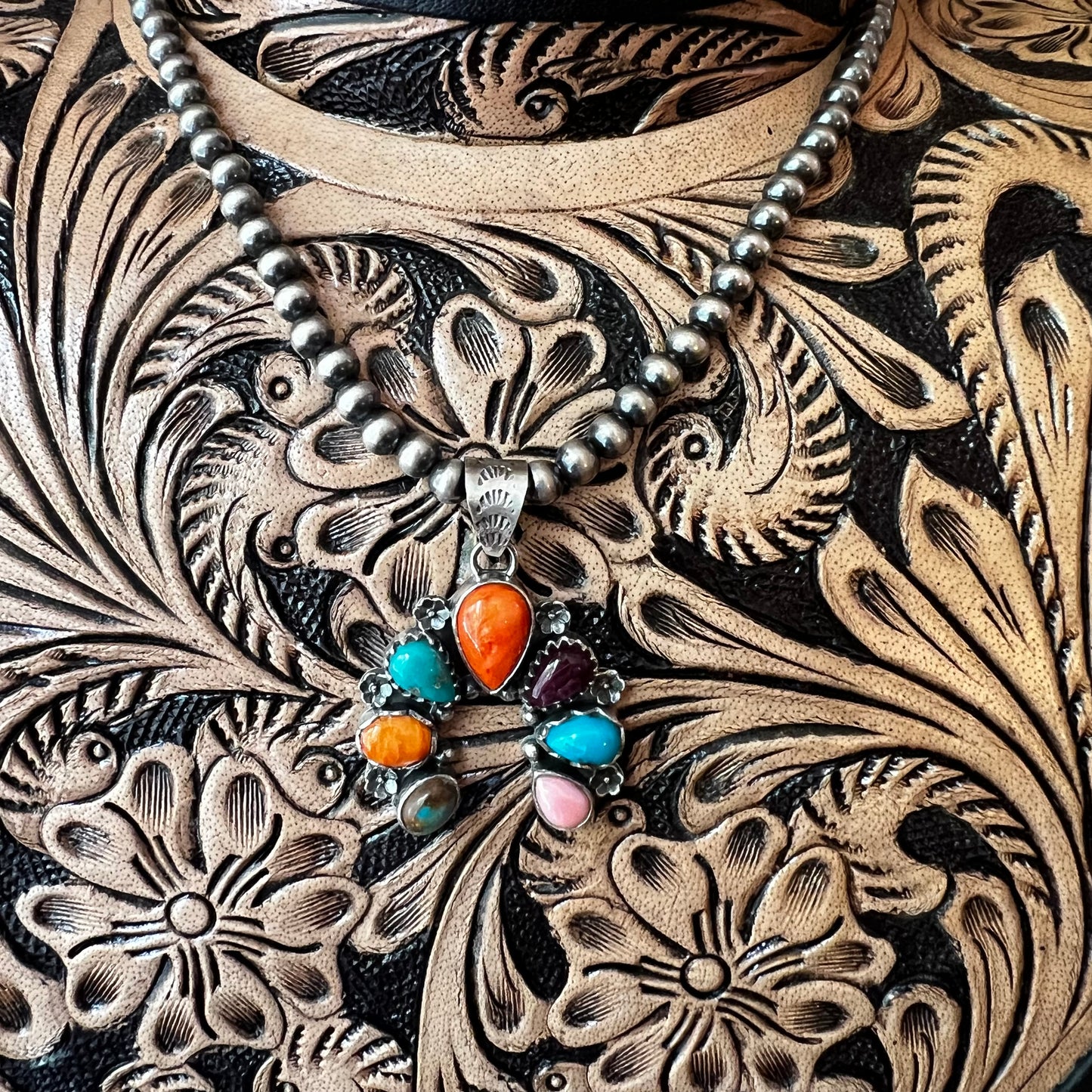 Website Title

Multi-Stone Sterling Silver Naja Pendant | Turquoise, Spiny Oyster & Queen Conch