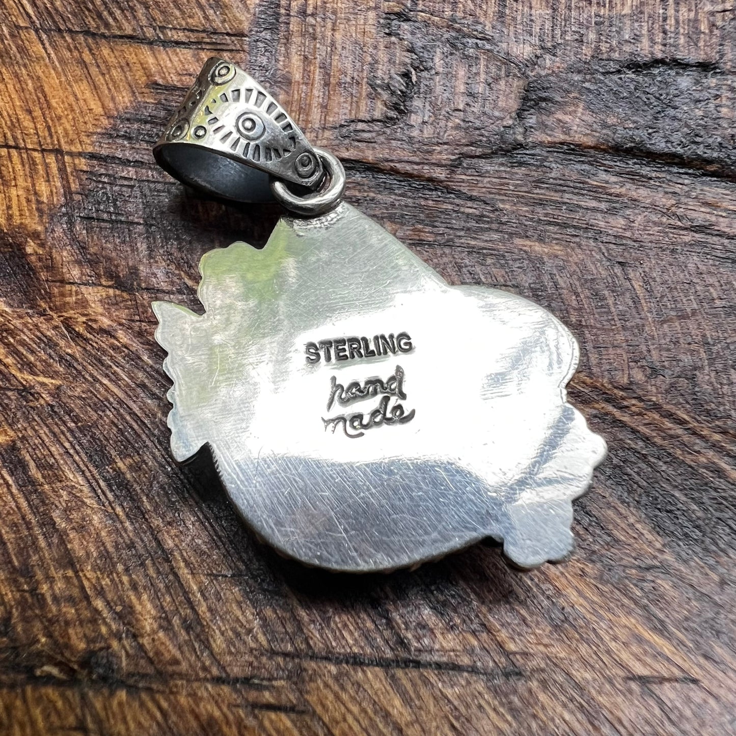 Kingman Turquoise Teardrop Pendant – Sterling Silver Floral Detail
