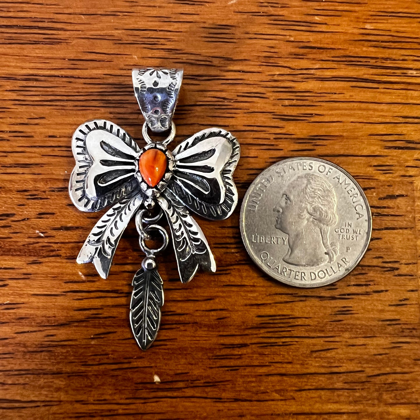 Spiny Oyster Bow Pendant in Sterling Silver with Feather Drop
