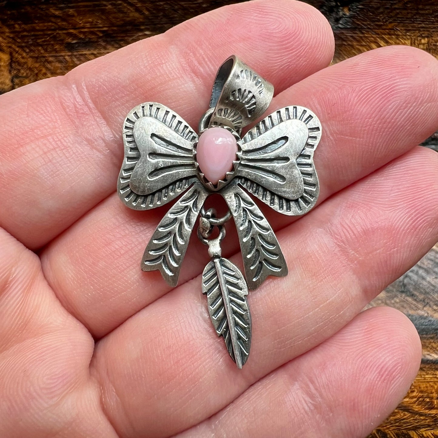 Sterling Silver Queen Conch Bow Pendant with Feather Dangle