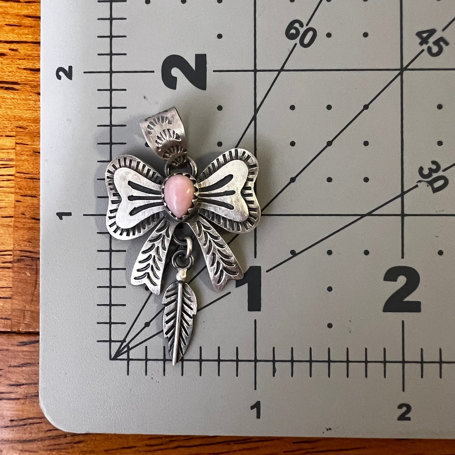 Sterling Silver Queen Conch Bow Pendant with Feather Dangle