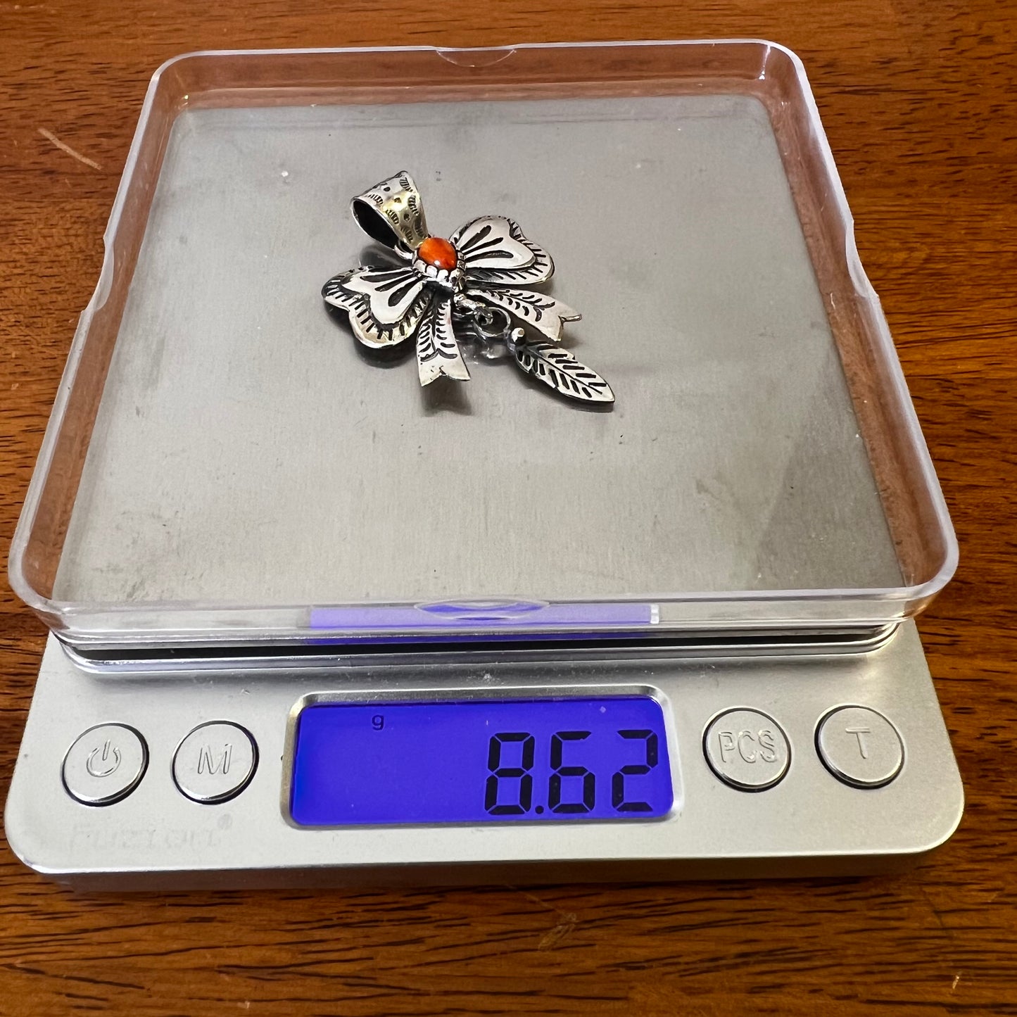 Spiny Oyster Bow Pendant in Sterling Silver with Feather Drop