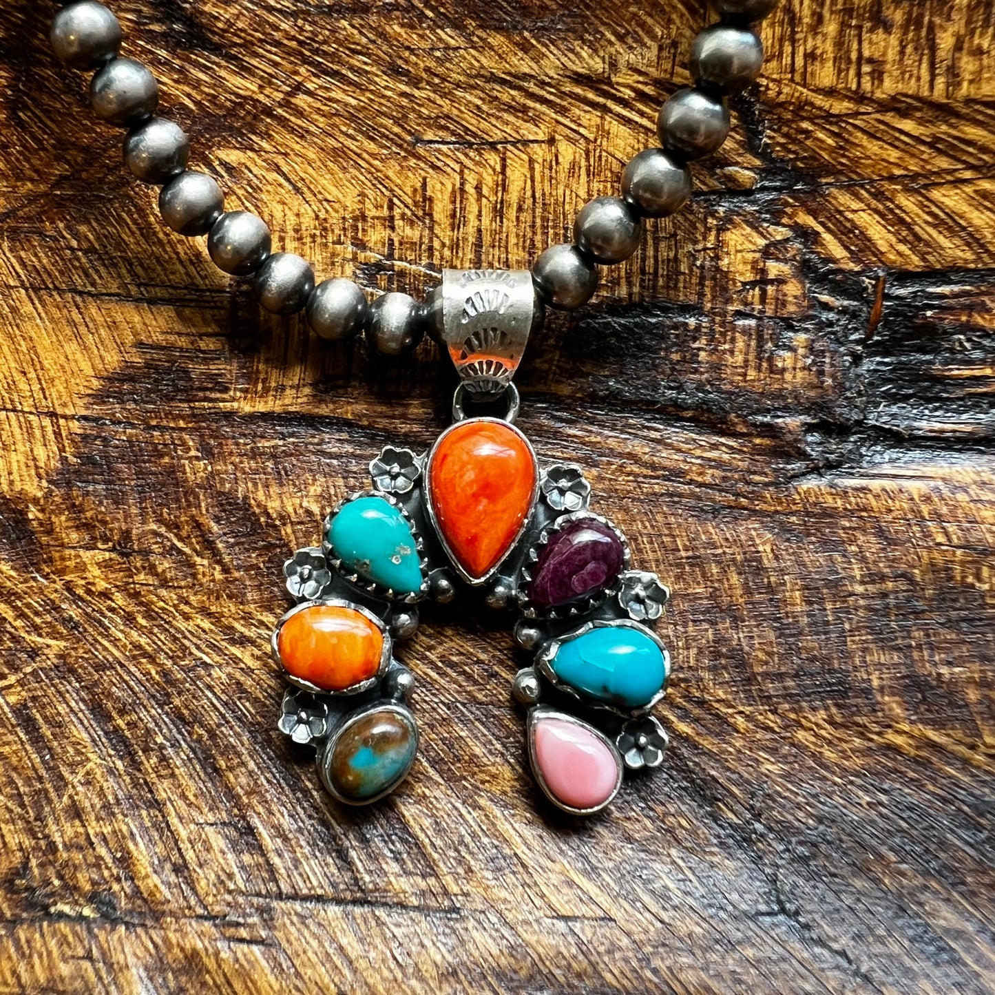 Website Title

Multi-Stone Sterling Silver Naja Pendant | Turquoise, Spiny Oyster & Queen Conch