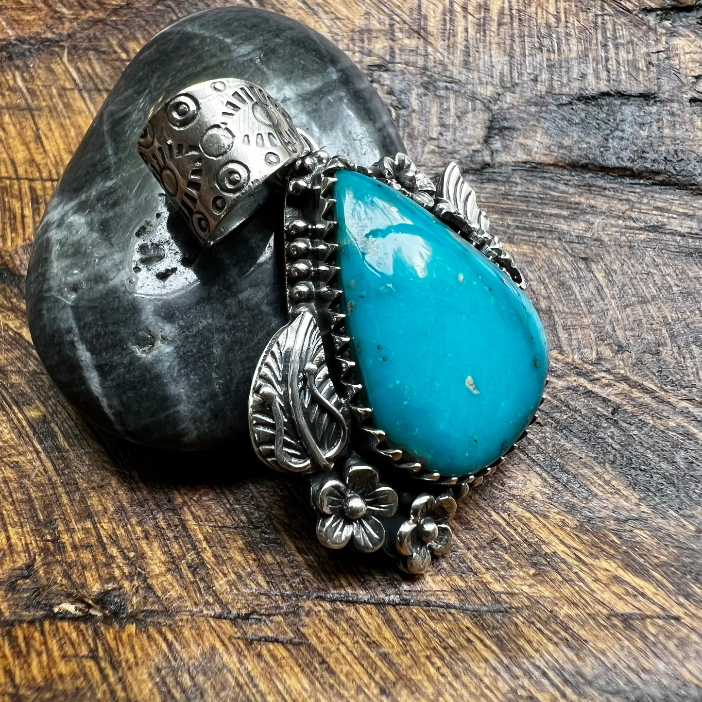Kingman Turquoise Teardrop Pendant – Sterling Silver Floral Detail