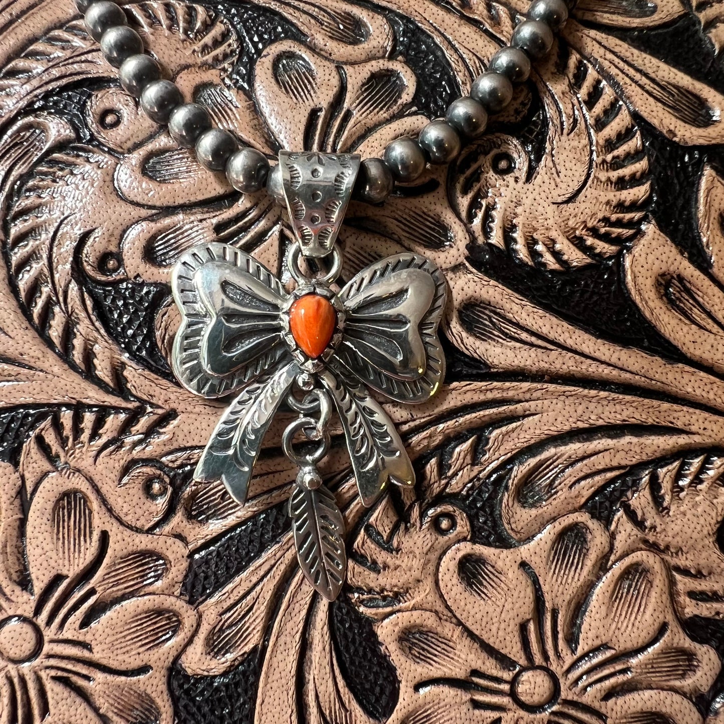 Spiny Oyster Bow Pendant in Sterling Silver with Feather Drop