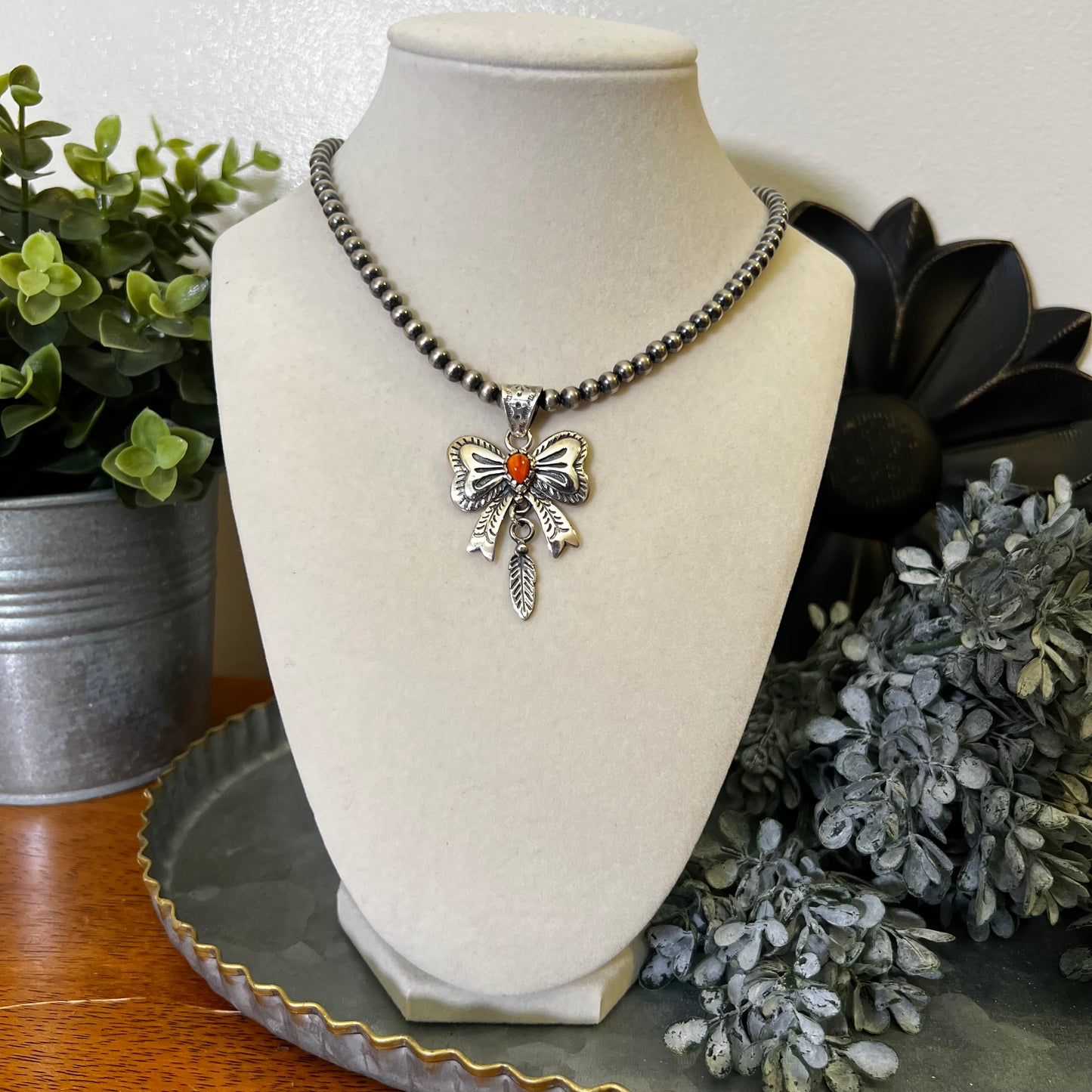 Spiny Oyster Bow Pendant in Sterling Silver with Feather Drop