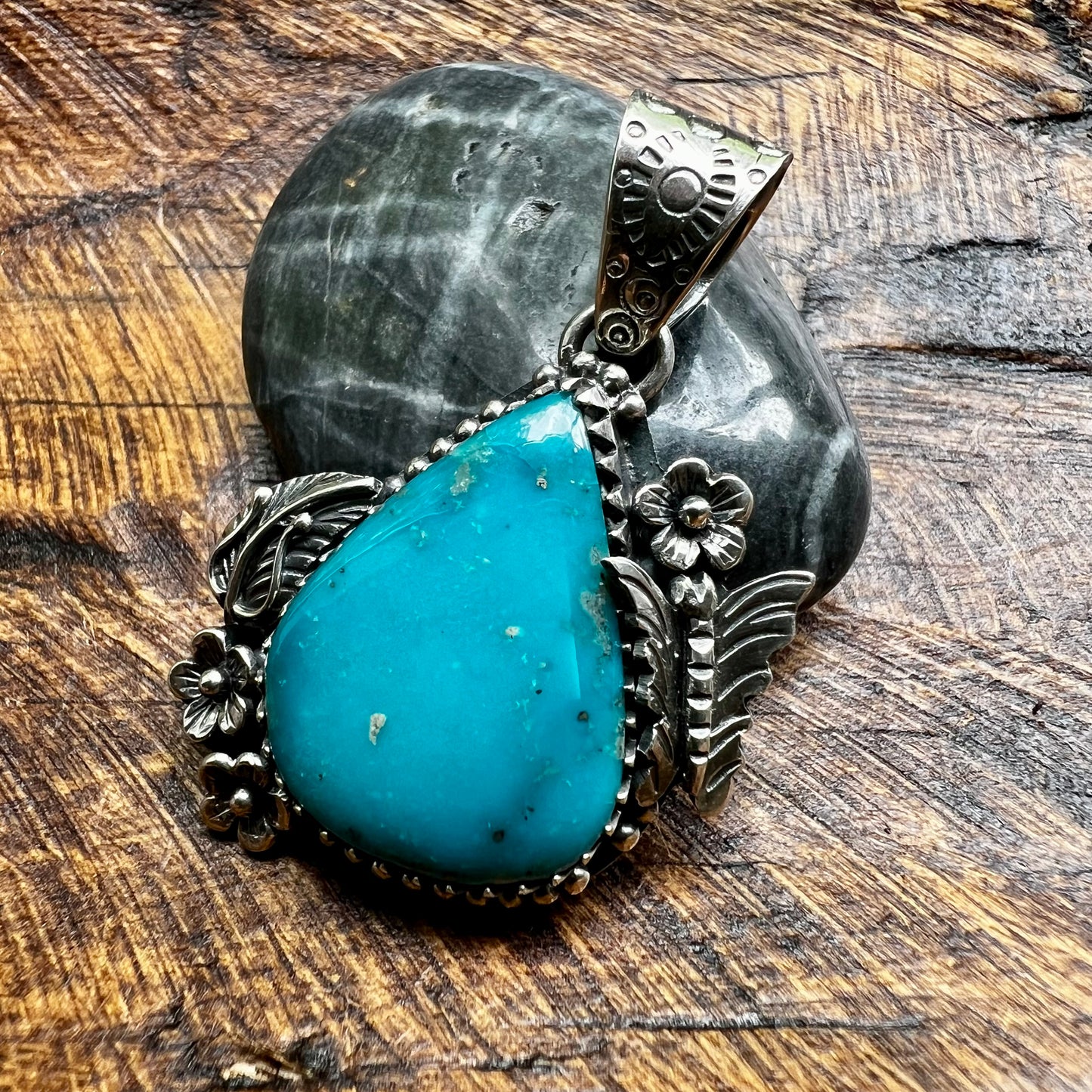Kingman Turquoise Teardrop Pendant – Sterling Silver Floral Detail